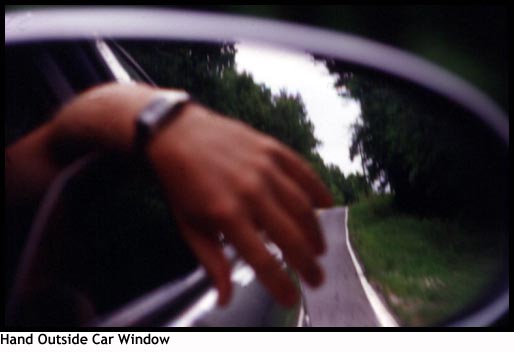 Hand Hanging Out Car Window