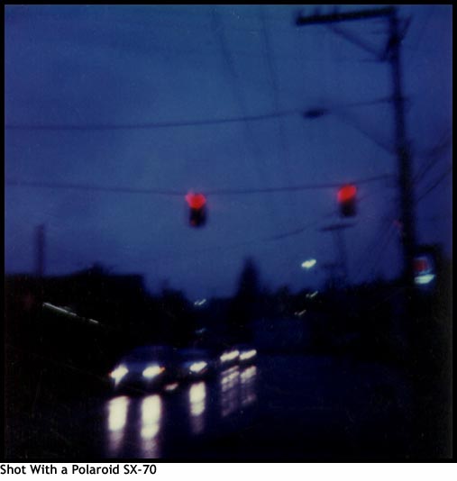 Polaroid of Wet Street at Night